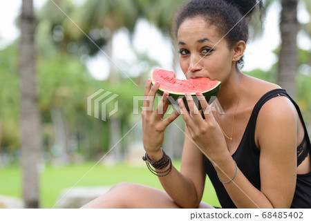 Portrait of young beautiful African woman at the park outdoors 68485402