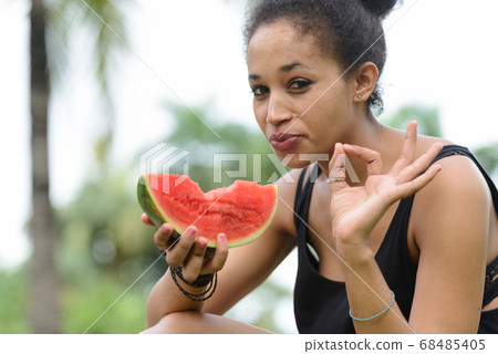 Portrait of young beautiful African woman at the park outdoors 68485405