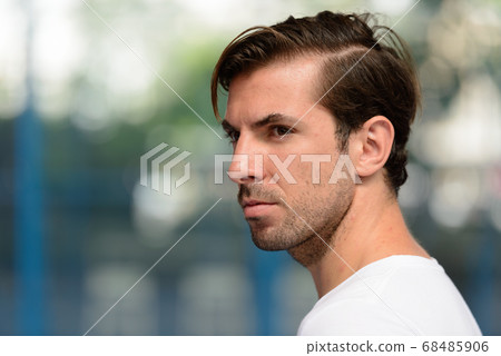 Young handsome Hispanic man at the padel court 68485906