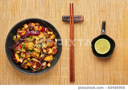 Kung Pao Paneer at black slate background.  68486908