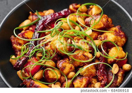 Kung Pao Paneer at black slate background. Close up 68486918