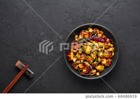 Kung Pao Paneer at black slate background.  68486919