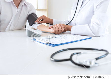 Doctor using stethoscope checking measuring 68487235