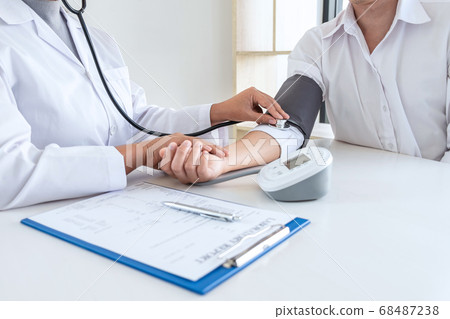 Doctor using stethoscope checking measuring Doctor using stethoscope checking measuring 68487238