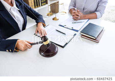 Professional Female lawyer discussing negotiation 68487425