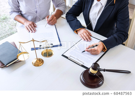 Professional female lawyer or counselor discussing Professional female lawyer or counselor discussing 68487563