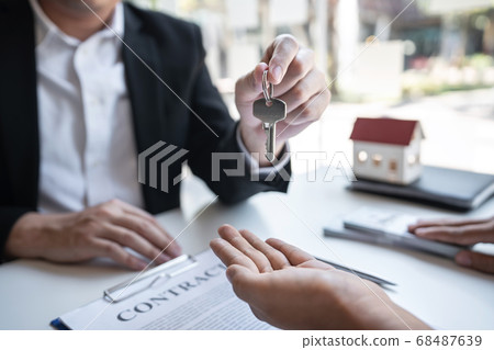 Real estate agent are presenting home loan and Real estate agent are presenting home loan and 68487639