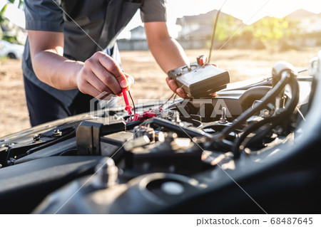 Mechanic repairman checking engine automotive in Mechanic repairman checking engine automotive in 68487645