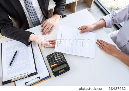 Employee sending resignation letter to boss Employee sending resignation letter to boss 68487682