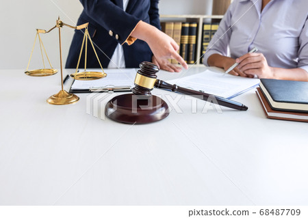 Professional female lawyer or counselor discussing Professional female lawyer or counselor discussing 68487709