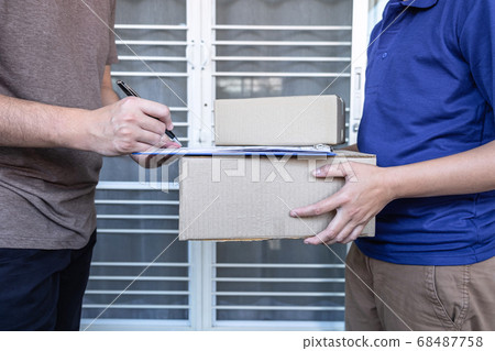 Young Delivery man deliver box parcel package and Young Delivery man deliver box parcel package and 68487758