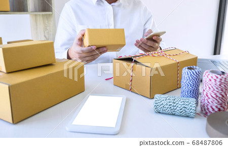 Young business owner work at home receive order Young business owner work at home receive order 68487806