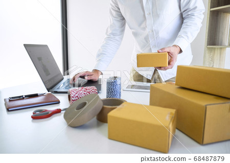Young business owner work at home receive order Young business owner work at home receive order 68487879