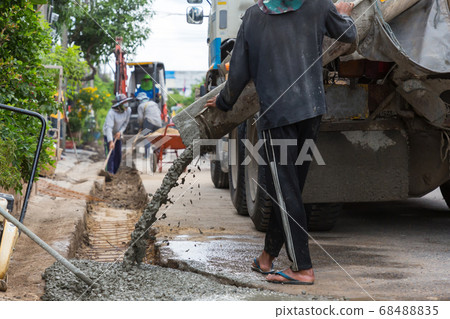 Mixed concrete pouring at construction site Mixed concrete pouring at construction site 68488835