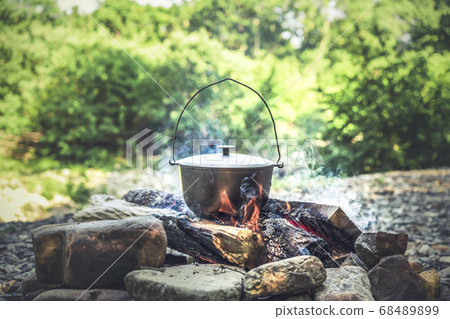 Traveling, tourism, picnic cooking, cooking in a cauldron on the fire 68489899