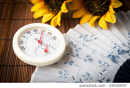 Midsummer day image Thermo-hygrometer, fan and sunflower 68490697