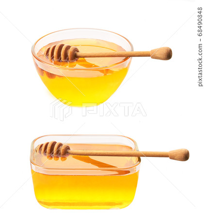 plate of natural honey isolated on white 68490848