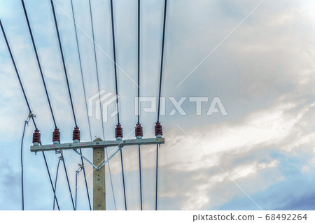 tensioned power lines attached to a pole against tensioned power lines attached to a pole against 68492264