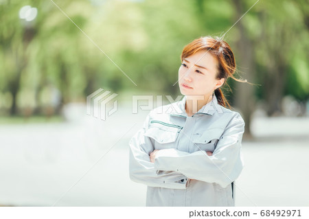 Employee wearing work clothes Employee wearing work clothes 68492971