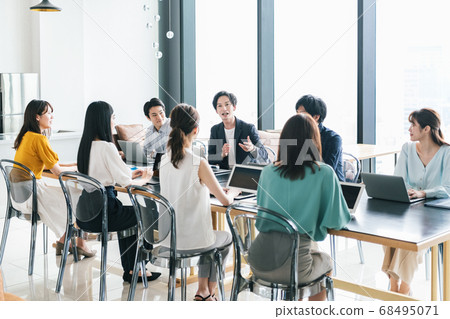 Staff meeting in a fashionable office Staff meeting in a fashionable office 68495071