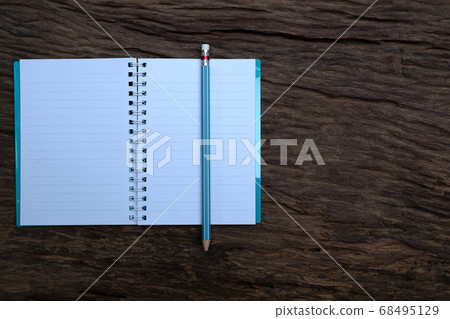 Pencil and book mockup on the old wood desk at the background, Flat lay photo, top view 68495129