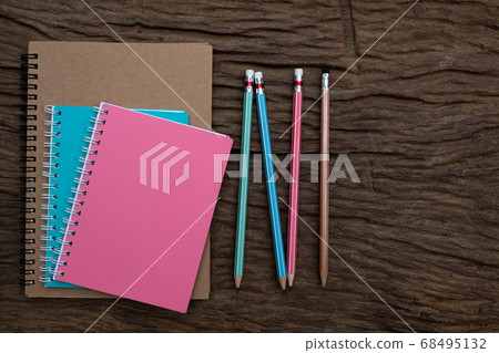 Pencil and book mockup on the old wood desk at the background, Flat lay photo, top view Pencil and book mockup on the old wood desk at the background, Flat lay photo, top view 68495132