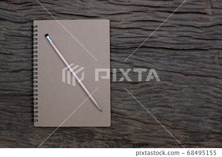 Pencil and book mockup on the old wood desk at the background, Flat lay photo, top view Pencil and book mockup on the old wood desk at the background, Flat lay photo, top view 68495155