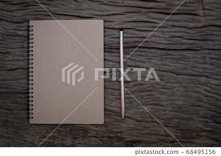 Pencil and book mockup on the old wood desk at the background, Flat lay photo, top view 68495156