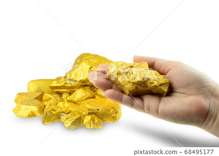 Woman hand holding gold nugget at the white background 68495177