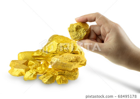 Woman hand holding gold nugget at the white background 68495178