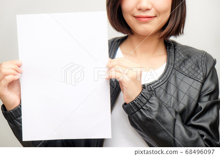 Smart business asian women hold b;ank white paper Smart business asian women hold b;ank white paper 68496097