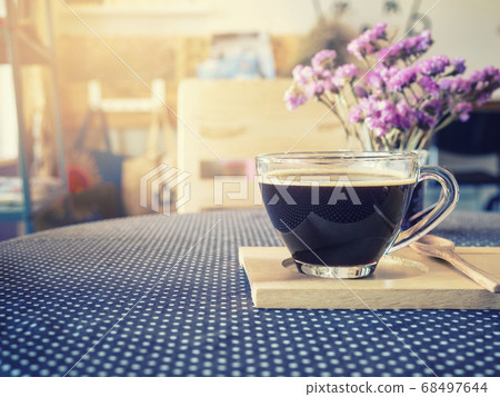 Coffee cup on table with flower decoration Cafe menu  68497644