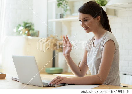 Pleasant millennial female teacher starting distant lesson online Pleasant millennial female teacher starting distant lesson online 68499136