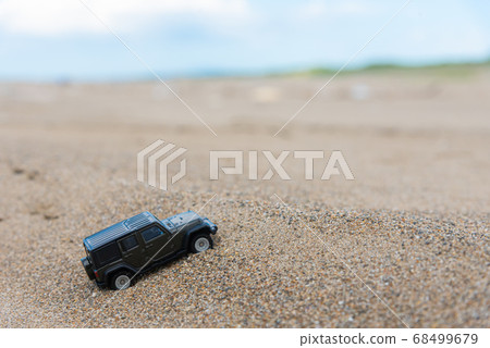 A car running on a rough road 68499679