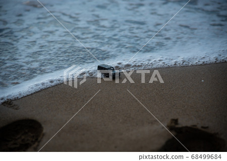 Car swept away by the waves 68499684