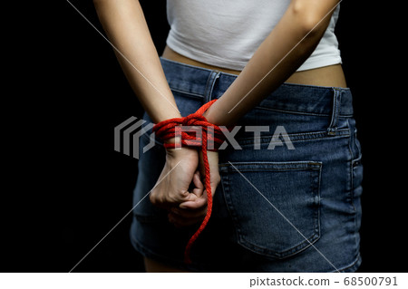 Victim women tied up with red rope Victim women tied up with red rope 68500791