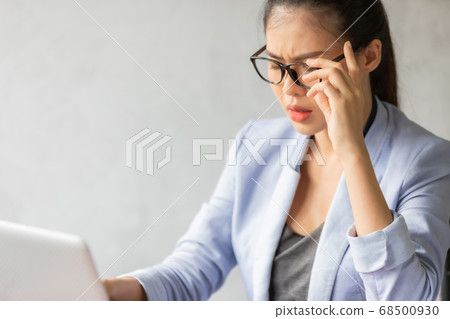 Business woman working  and see information from laptop. 68500930
