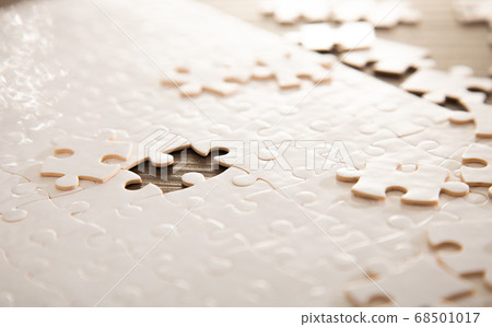 close up of white jigsaw puzzle close up of white jigsaw puzzle 68501017