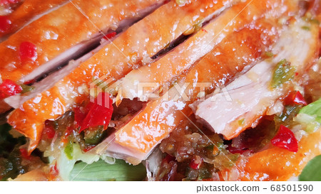 Sliced roasting Traditional Christmas Duck dressing with salad tomatoes and spicy sweet sauce at gourmet chinese restaurant, food advertisement backgrounds Sliced roasting Traditional Christmas Duck dressing with salad tomatoes and spicy sweet sauce at gourmet chinese restaurant, food advertisement backgrounds 68501590