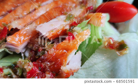 Sliced roasting Traditional Christmas Duck dressing with salad tomatoes and spicy sweet sauce at gourmet chinese restaurant, food advertisement backgrounds Sliced roasting Traditional Christmas Duck dressing with salad tomatoes and spicy sweet sauce at gourmet chinese restaurant, food advertisement backgrounds 68501591