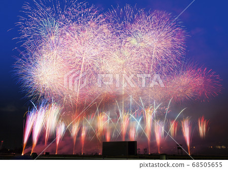 Fireworks display shining in the night sky Fireworks display shining in the night sky 68505655