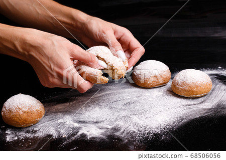 Homemade pastries. White buns are separated by hand. Photo of baking. 68506056