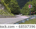 Curved asphalt road in high mountains. summer day 68507396