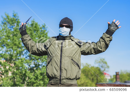 A protester with a knife surrenders to authorities during protests 68509096