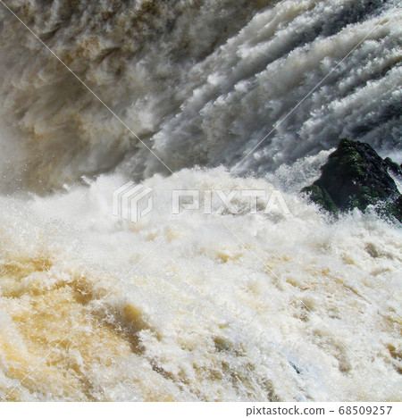 Iguazu waterfalls with the blue sky in Iguazu National park in Argentina 68509257