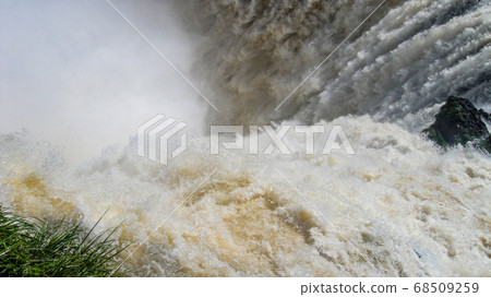 Iguazu waterfalls with the blue sky in Iguazu National park in Argentina 68509259