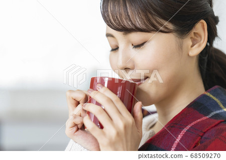 A young lady with a mug A young lady with a mug 68509270