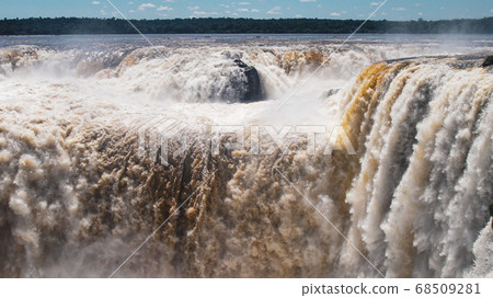 Iguazu waterfalls with the blue sky in Iguazu National park in Argentina 68509281