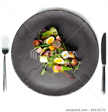 Isolated summer salad with quail eggs Isolated summer salad with quail eggs 68510170