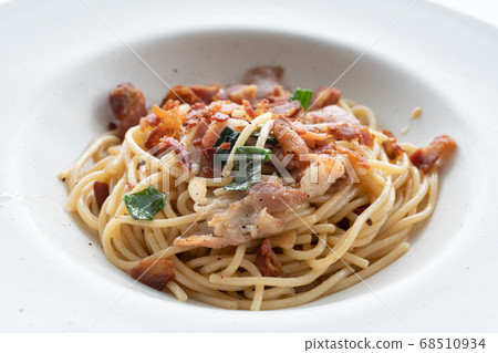 spaghetti with basil pesto and bacon - Italian food 68510934